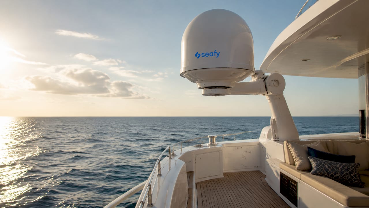 Satellite antenna on ship deck by sea