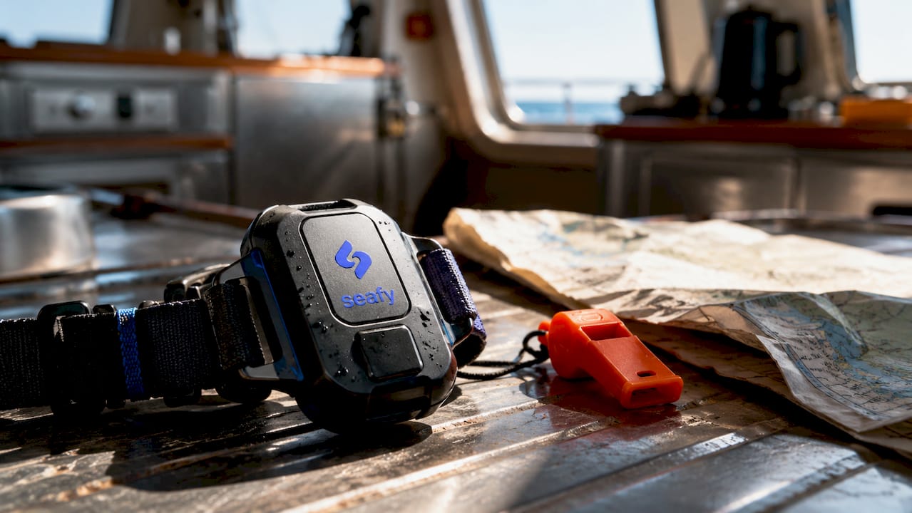 Close-up of wearable maritime safety device on wooden surface